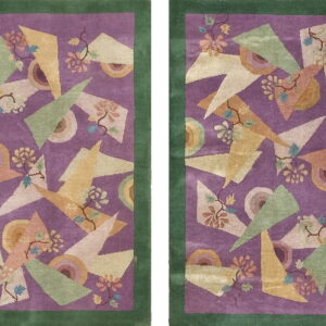 A pair of purple and green bordered rugs with multicolored geometric and abstract floral patterns.