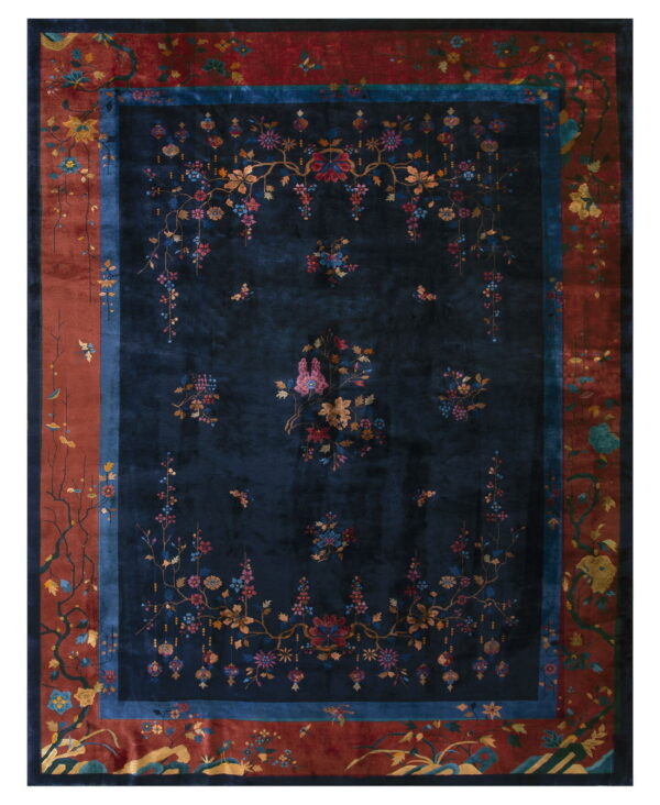 Navy blue area rug with detailed multi-colored floral vines and a rust red border design.