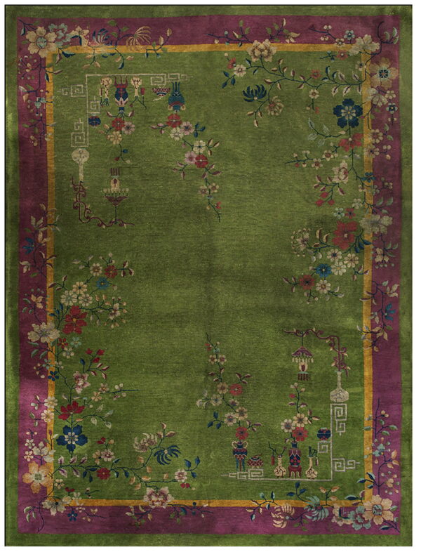 A chartreuse green rug features a deep magenta border and an elaborate vine and floral motif pattern.