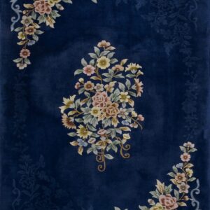 Velvety dark blue rug with multicolored floral bunches and faint tone-on-tone background designs.