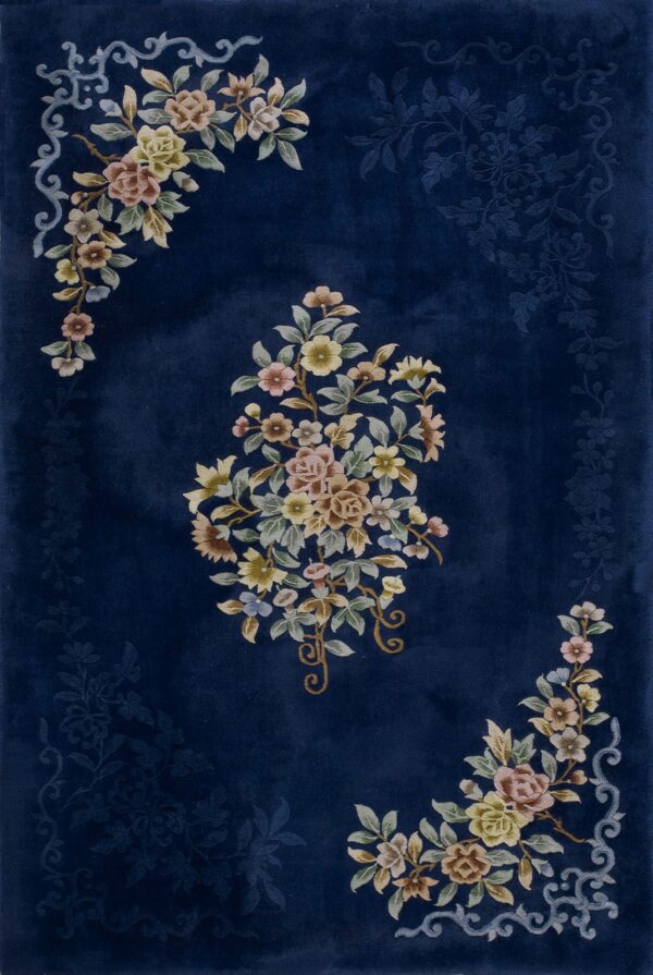 Velvety dark blue rug with multicolored floral bunches and faint tone-on-tone background designs.