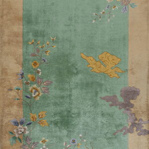 Long green runner rug framed by a tan border, featuring multicolored floral vines and detailed birds.