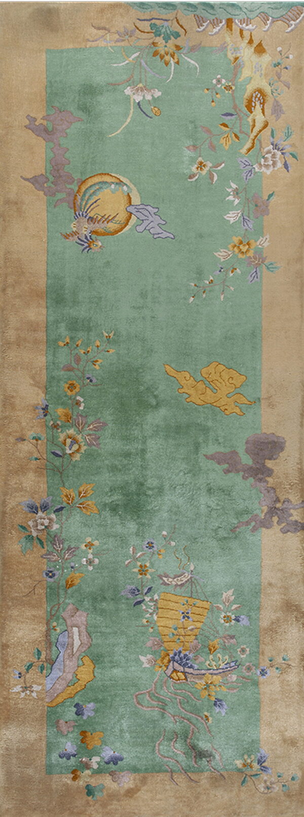 Long green runner rug framed by a tan border, featuring multicolored floral vines and detailed birds.