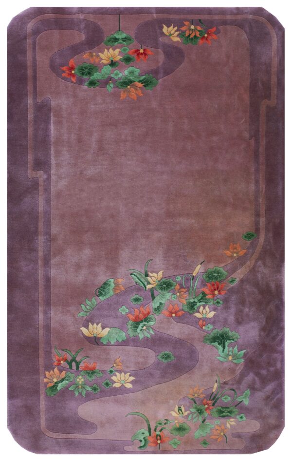 Purple rug with sculpted orange and yellow floral designs outlining a winding mauve border.