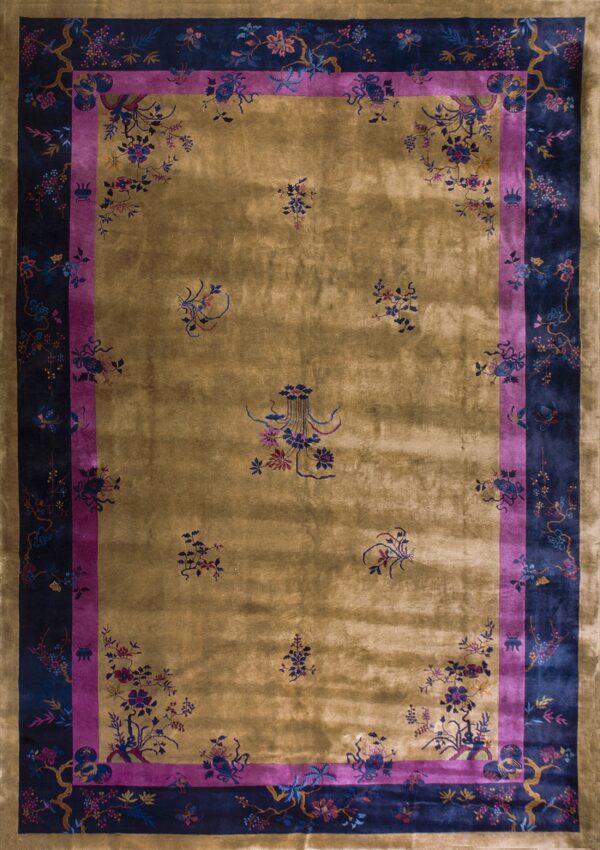 Lustrous gold rug featuring a navy and magenta triple border with scattered botanical designs.