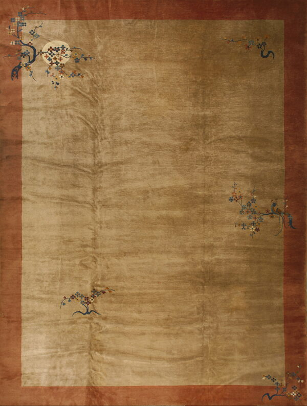 Smooth golden-taupe rug featuring a rust border and minimalist corner designs of colorful branches and birds.