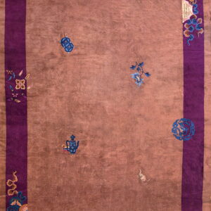 Mauve and purple rug featuring a wide border and scattered blue, gold, and pink decorative symbols.