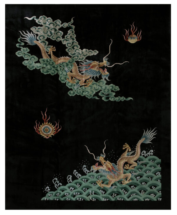 Detailed black rug featuring two golden dragons flying above green clouds and ocean waves.