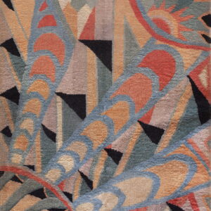 Abstract low-pile rug featuring bold geometric arcs and triangles in black, rust, blue, and sage colors.