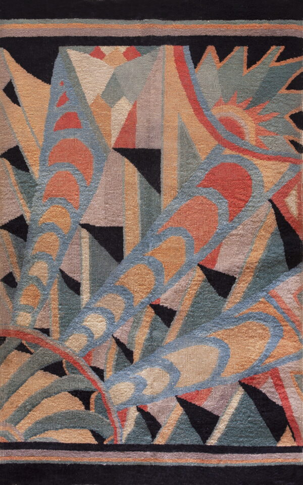 Abstract low-pile rug featuring bold geometric arcs and triangles in black, rust, blue, and sage colors.