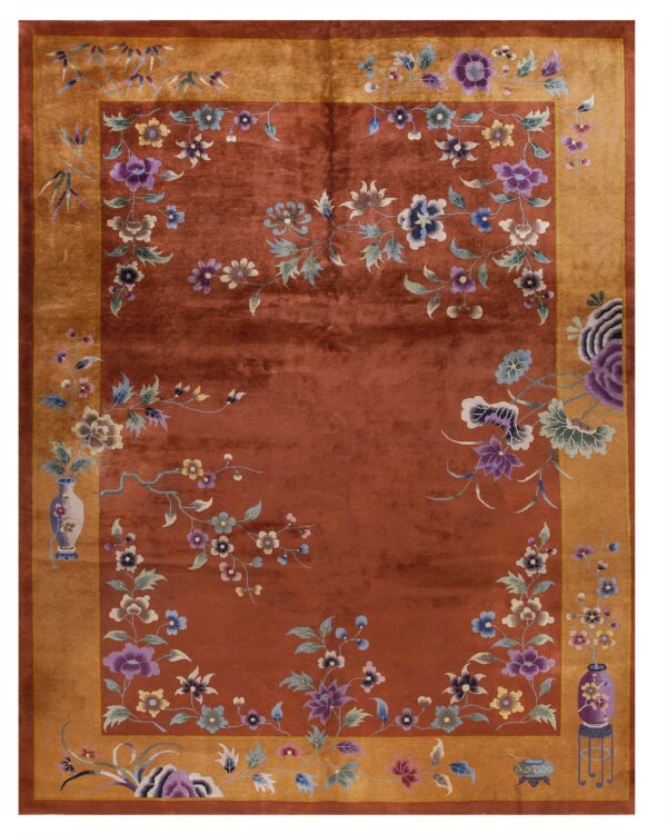 Terracotta rug with a golden border and a repeating pattern of multicolor floral vines and vases.