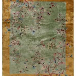 Sage green rug with a wide gold border features climbing pink and blue stylized floral vines.
