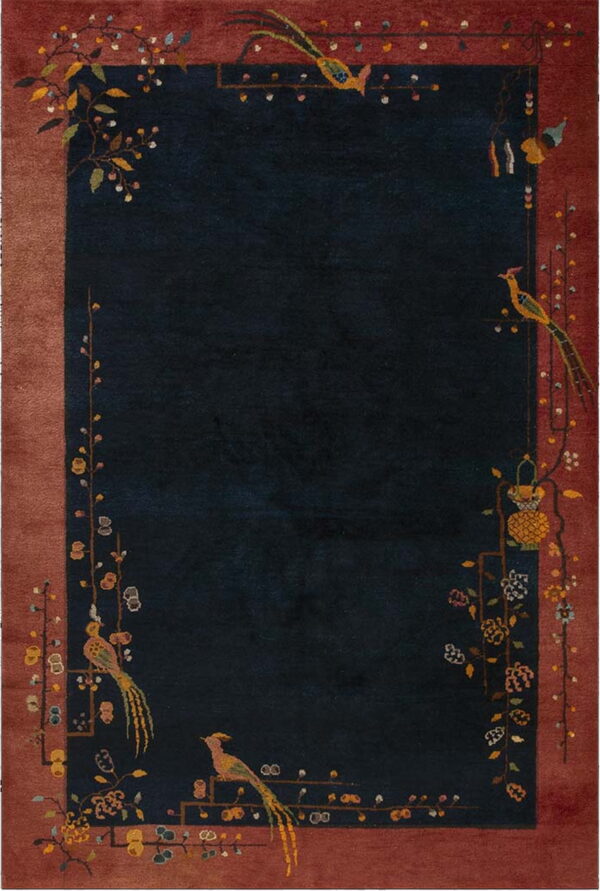 Dark navy rug centered in a wide reddish-brown border adorned with intricate bird and floral designs.