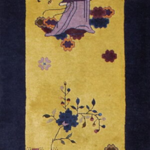 Golden yellow runner rug with a navy border and two colorful figures among stylized flowers.