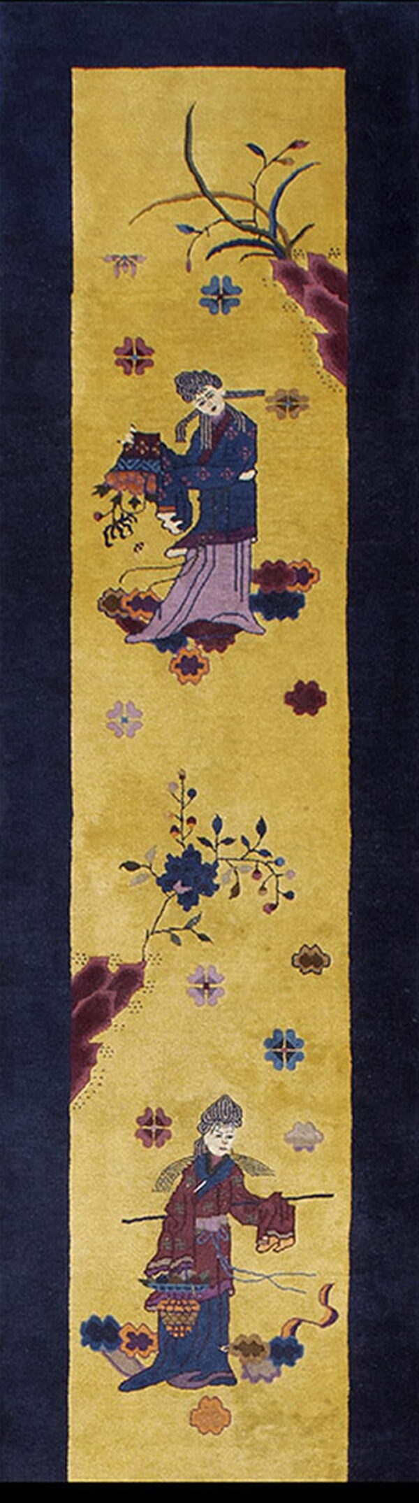Golden yellow runner rug with a navy border and two colorful figures among stylized flowers.