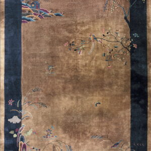 A large brown and navy blue rug features elaborate Chinoiserie floral and bird motifs.