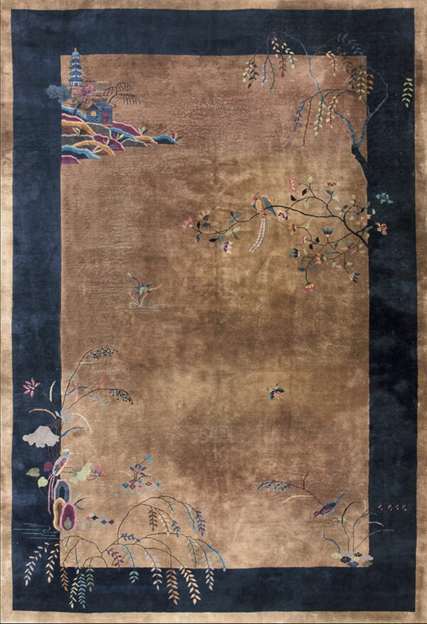 A large brown and navy blue rug features elaborate chinoiserie floral and bird motifs.