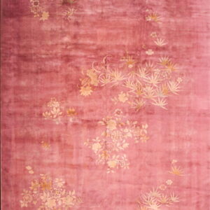 A long, shaded pink rug featuring scattered clusters of pale beige botanical motifs.