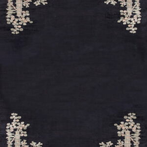 Black rug featuring light gray and pink pagoda and floral designs restricted to the four corners.