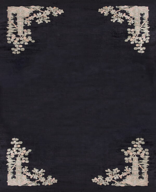 Black rug featuring light gray and pink pagoda and floral designs restricted to the four corners.