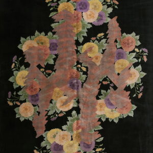 Black area rug featuring a colorful floral arrangement overlaid by large abstract brown textured forms.