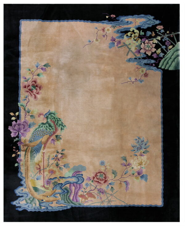 Tan rug with a black border, featuring colorful floral motifs and a large blue and green bird design.