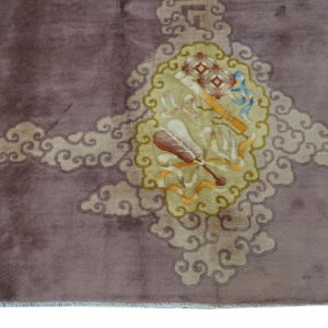 A mauve rug features a central yellow medallion with symbolic objects, surrounded by swirling cloud motifs.