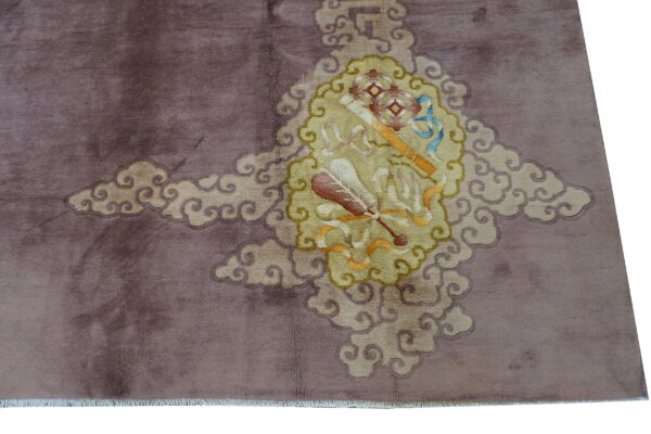 A mauve rug features a central yellow medallion with symbolic objects, surrounded by swirling cloud motifs.
