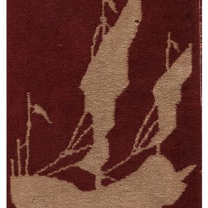 Burgundy low pile rug featuring a tan silhouette graphic of a large sailing ship.