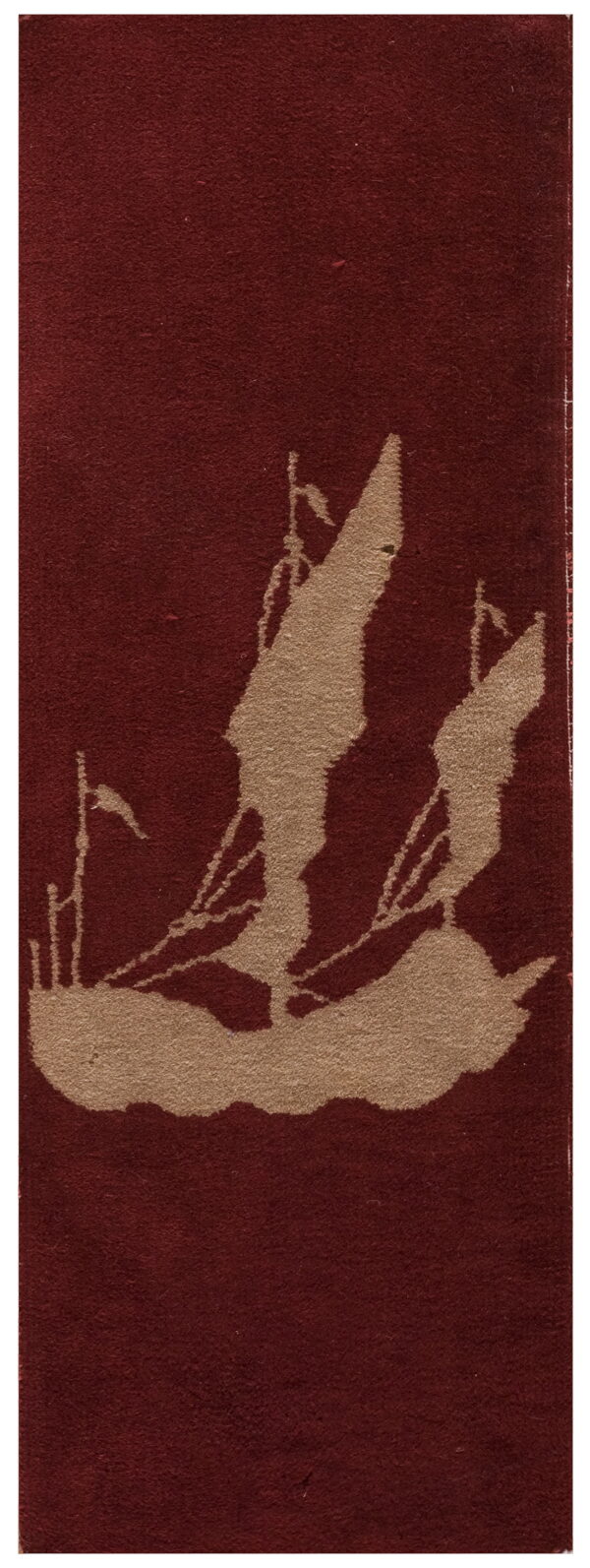 Burgundy low pile rug featuring a tan silhouette graphic of a large sailing ship.