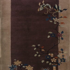 Vertical rug with a deep purple field, tan border, and multicolored vases and floral patterns.