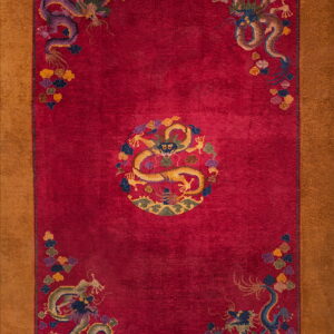 Red dragon-patterned rug with a central medallion and corner motifs, framed by a wide tan border.