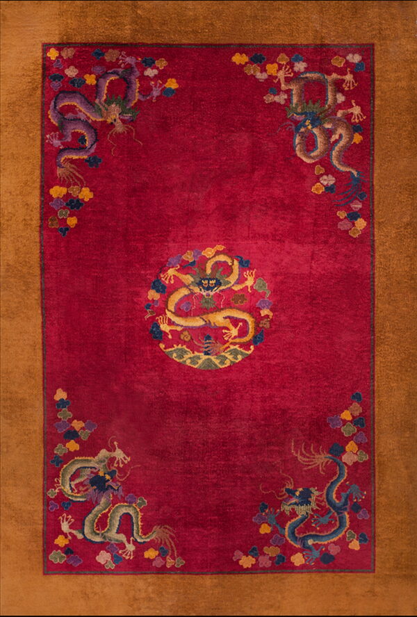 Red dragon-patterned rug with a central medallion and corner motifs, framed by a wide tan border.