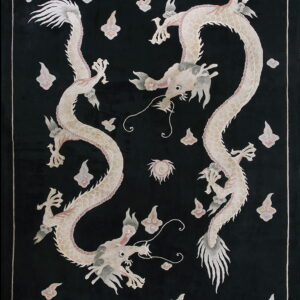 Black rug featuring two intertwined light cream dragons and scattered grey and pink cloud motifs.