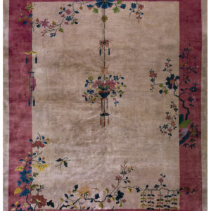 High pile rug featuring a beige center, rose border, and colorful flowering branches and hanging decorations.