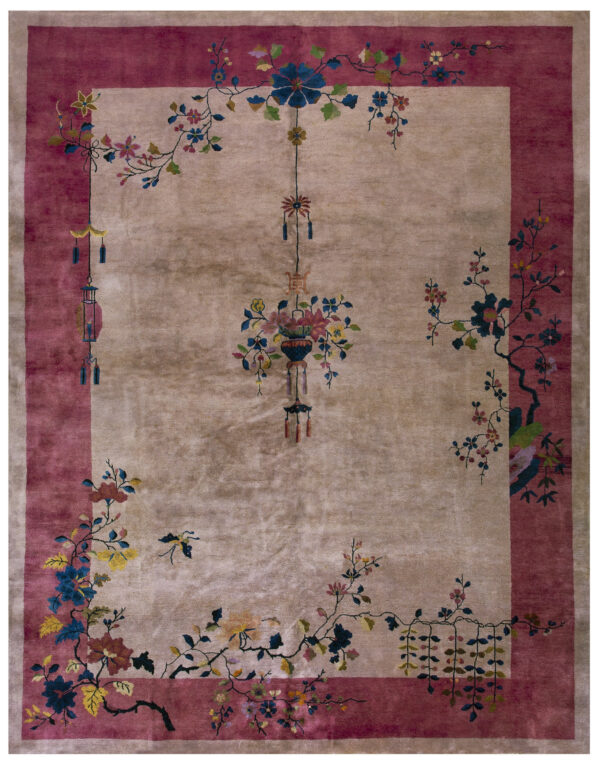 High pile rug featuring a beige center, rose border, and colorful flowering branches and hanging decorations.