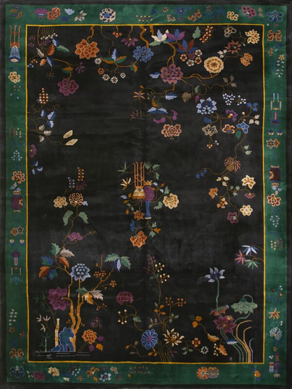 Black rug with vibrant multicolored botanicals and a striking green border framed by a thin yellow line.