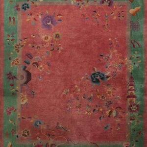 A deep rose rug with a sage green border featuring colorful flowers, vases, butterflies, and traditional Chinese motifs.
