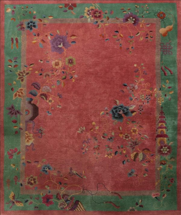 A deep rose rug with a sage green border featuring colorful flowers, vases, butterflies, and traditional chinese motifs.