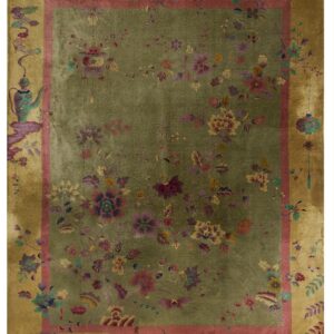 Olive green rug with colorful floral motifs, framed by a rose guard border and golden outer edge.