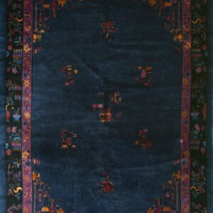Deep blue rug with scattered vase motifs and elaborate black borders featuring colorful flowers and birds.