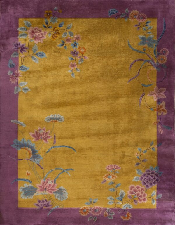 Gold plush rug with a wide purple border and colorful floral vine details.