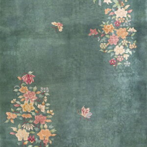 A dusty teal rug featuring large asymmetrical floral groupings in pink, orange, and cream colors.