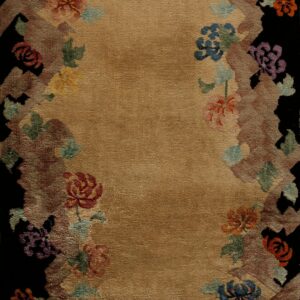 Tan medium-pile rug featuring a border of multicolored florals and earth tones outlining a black edge.