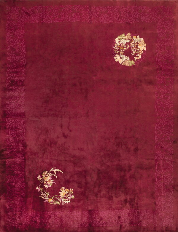 Plush maroon rug with a darker tonal border and multi-colored cream and green floral accents on the field.