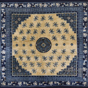 Square rug featuring a tan field with small blue florals and a complex navy border with geometric motifs.
