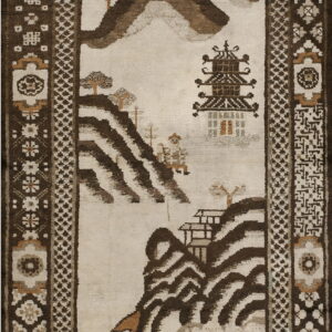 Beige and brown rug featuring a landscape scene of mountains, trees, and a tiered pagoda structure.