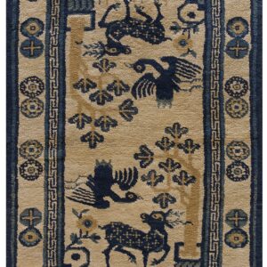Low-pile tan rug featuring dark blue birds, trees, and deer motifs with elaborate borders.