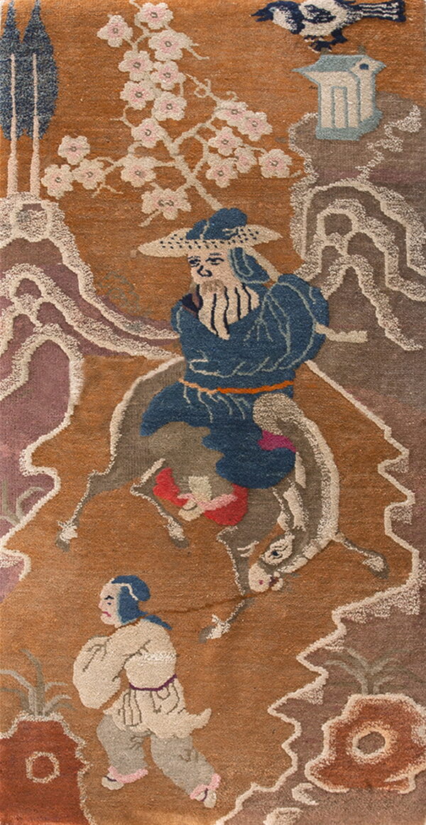 Illustrative rug panel in rust and blue showing figures, a horse, stylized clouds, and pink cherry blossoms.