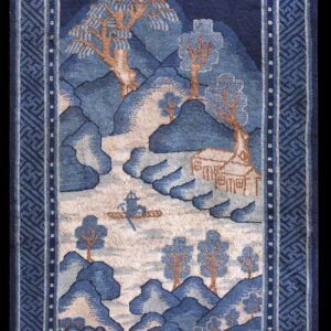 High-pile rug in indigo and beige featuring a mountain and water landscape with a detailed geometric border.